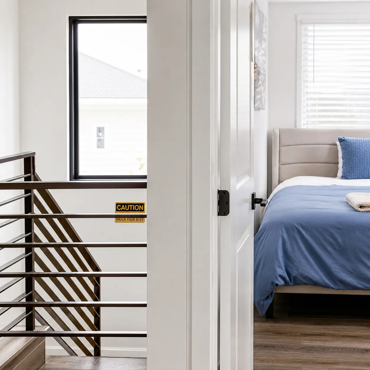 Client bedroom viewed from the stairway landing at Double Peak Recovery